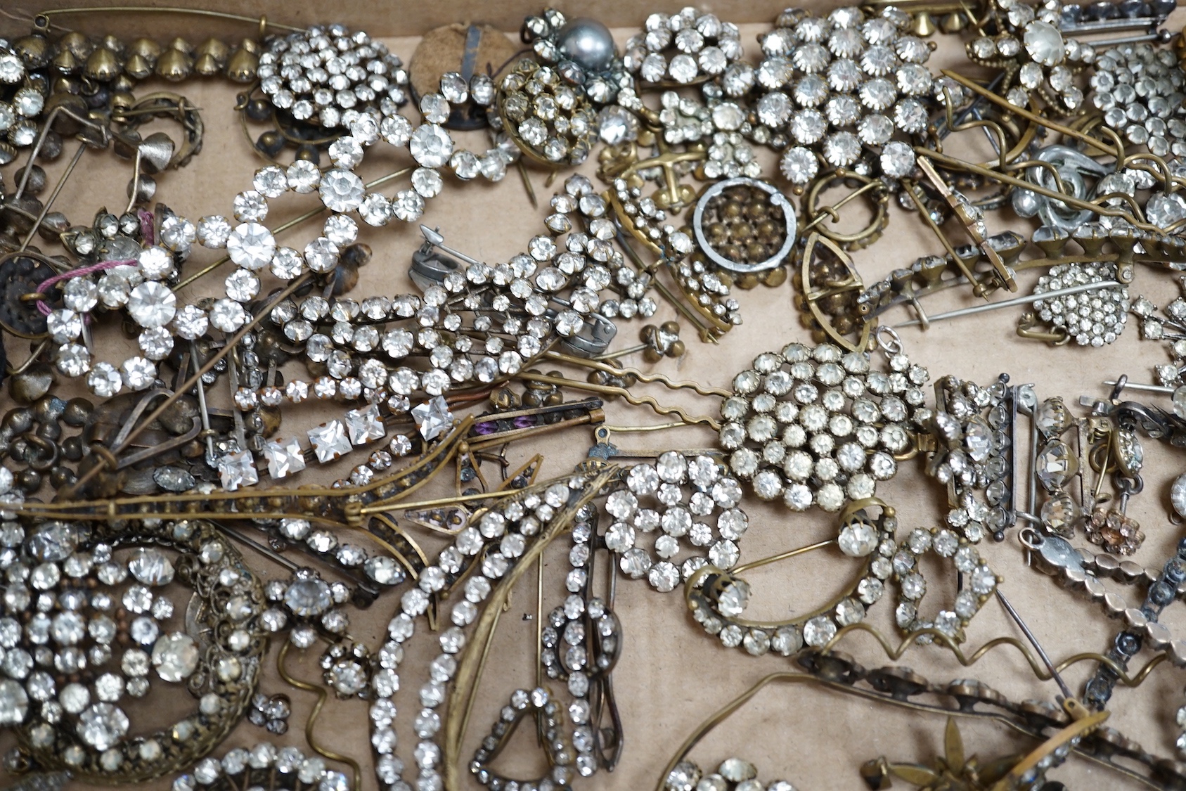 A quantity of assorted white paste jewellery, including brooches, hair ornament, etc.